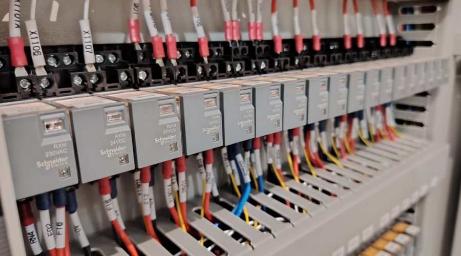 Electrical Maintenance Best Practices for Aging Infrastructure Old buildings and power grids have a lot of character, but their electrical systems are often living on borrowed time. As infrastructure ages, the risk of unexpected blackouts, equipment failure, and electrical fires goes up every year. You cannot treat a thirty-year-old electrical panel the same way you treat a brand new one. Maintaining these systems is about more than just fixing things when they break. It requires a proactive strategy to keep power flowing safely and efficiently. Here are a few maintenance habits that can help you extend the life of your equipment and avoid the massive costs of a complete system overhaul: Start With a Clear System Review The first step in maintaining aging infrastructure is understanding what is in place. Many older buildings have outdated wiring, modified circuits, and hidden junctions that weren’t documented properly. A thorough system review can map out electrical panels, feeders, and key electrical components. Using tools like thermal cameras and load meters can identify stressed circuits or overheating connections. You should also observe how light fixtures, smoke alarms, and industrial electricity setups are wired, since these can reveal potential shock and electrocution hazards before they become serious. Consider working with industry experts, such as Anode Electrical Contractors, who are experienced in both commercial and residential projects. They can help identify hidden issues, recommend practical upgrades, and guide you on complying with the electrical code. Their experience can also make it easier to prioritise repairs and maintenance, so you address the most critical risks first. Keep Documentation Fresh and Usable Outdated diagrams and faded labels can make electrical maintenance slower and more stressful. Technicians might spend extra time tracing circuits or guessing connections, which can lead to mistakes. Keeping clear records of electrical installations and updates helps everyone work more efficiently and safely. Simple steps like updating panel schedules, labelling breakers, and storing digital copies of wiring layouts can save time during repairs. Recording each inspection or upgrade also builds a handy history for both residential and commercial wiring, as well as industrial electricity systems. Focus on Connections and Terminations Loose or corroded connections are a common cause of problems in older electrical equipment. Terminals, bus bars, and grounding points can wear down over time from heat, vibration, and dust. Checking accessible connections and tightening or cleaning them can reduce erratic behaviour. You should also keep an eye on control devices, switches, and other electrical components. If they show significant wear, replacing them, even small parts like corroded lugs, can improve stability and lower the risk of power surges or electrical fires. Maintain Protective Devices Carefully Breakers, fuses, and relays often get overlooked until something goes wrong. In older systems, they might not have been tested for years, and dust, age, or wear can affect how they work. Regular testing will help ensure protective devices function as they should. Checking breaker movement, relay settings, and fuse condition can catch problems before they affect power systems. When devices are outdated, planning gradual replacements in line with the electrical code can reduce risks down the line. Watch Load Growth and Circuit Stress Older infrastructure often supports more devices than it was designed for. Additional lighting systems, servers, air conditioners, and other equipment increase demand on circuits. Without careful monitoring, this invisible energy drain can overload the wiring and electrical panels. Conducting load studies will help you see which circuits carry the heaviest load. You should also balance three-phase systems or redistribute connections to ease stress on residential and commercial electrical systems. Keeping an eye on peak draw can reduce breaker trips, equipment wear, and potential safety hazards. Pay Attention to Cables and Insulation Electrical wiring in older buildings can degrade from heat, moisture, or mechanical stress. Insulation may crack or dry out, increasing the risk of shock and electrocution hazards. Rodents and overcrowded conduits can also damage cables over time. Visual inspections and insulation resistance tests can identify weak spots in residential and commercial wiring or industrial electricity networks. Rerouting or replacing worn cables can be safer than repeated patching, especially in areas with critical lighting systems, smoke alarms, or other essential devices. Control the Environment Around Equipment Electrical equipment can wear out faster in poor conditions. Dust, humidity, and heat can shorten the life of panels, breakers, and other components, so environmental control should be part of any maintenance routine. Regular cleaning of electrical rooms, checking ventilation, and monitoring temperature can reduce stress on wiring and control devices. Keeping storage away from panels, light fixtures, and other components helps maintain airflow and makes inspections simpler and safer. Build a Practical Preventive Maintenance Plan A preventive maintenance plan provides structure to daily upkeep. Instead of reacting to faults, teams can follow a schedule for inspection, testing, and cleaning. Older and critical systems, like main electrical panels and industrial electricity setups, could be checked more frequently. Using work orders, checklists, and notes from each visit builds a history of the system. That record can highlight recurring issues and inform budgeting for repairs, upgrades, or eventual replacement. Support Staff With Training and Clear Procedures Older electrical systems can behave differently from modern installations. Indicators may be limited, and manual controls might be unfamiliar to newer staff. Providing hands-on training can help your team work safely with electrical systems. Clear lockout and isolation procedures, along with simple guides on panels, breakers, and control devices, can reduce mistakes. Encouraging staff to report unusual heat, sounds, or sparks helps catch problems early. Conclusion Aging electrical infrastructure doesn't have to be a ticking time bomb. With consistent attention and the right maintenance practices, older systems can stay safe and reliable. The key is shifting from reactive fixes to proactive care. While you can't eliminate every risk, you can catch warning signs early and make smart decisions about when to repair and when to replace.