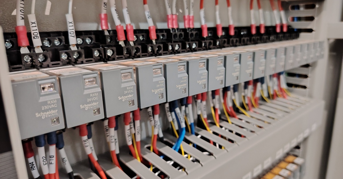 Electrical Maintenance Best Practices for Aging Infrastructure Old buildings and power grids have a lot of character, but their electrical systems are often living on borrowed time. As infrastructure ages, the risk of unexpected blackouts, equipment failure, and electrical fires goes up every year. You cannot treat a thirty-year-old electrical panel the same way you treat a brand new one. Maintaining these systems is about more than just fixing things when they break. It requires a proactive strategy to keep power flowing safely and efficiently. Here are a few maintenance habits that can help you extend the life of your equipment and avoid the massive costs of a complete system overhaul: Start With a Clear System Review The first step in maintaining aging infrastructure is understanding what is in place. Many older buildings have outdated wiring, modified circuits, and hidden junctions that weren’t documented properly. A thorough system review can map out electrical panels, feeders, and key electrical components. Using tools like thermal cameras and load meters can identify stressed circuits or overheating connections. You should also observe how light fixtures, smoke alarms, and industrial electricity setups are wired, since these can reveal potential shock and electrocution hazards before they become serious. Consider working with industry experts, such as Anode Electrical Contractors, who are experienced in both commercial and residential projects. They can help identify hidden issues, recommend practical upgrades, and guide you on complying with the electrical code. Their experience can also make it easier to prioritise repairs and maintenance, so you address the most critical risks first. Keep Documentation Fresh and Usable Outdated diagrams and faded labels can make electrical maintenance slower and more stressful. Technicians might spend extra time tracing circuits or guessing connections, which can lead to mistakes. Keeping clear records of electrical installations and updates helps everyone work more efficiently and safely. Simple steps like updating panel schedules, labelling breakers, and storing digital copies of wiring layouts can save time during repairs. Recording each inspection or upgrade also builds a handy history for both residential and commercial wiring, as well as industrial electricity systems. Focus on Connections and Terminations Loose or corroded connections are a common cause of problems in older electrical equipment. Terminals, bus bars, and grounding points can wear down over time from heat, vibration, and dust. Checking accessible connections and tightening or cleaning them can reduce erratic behaviour. You should also keep an eye on control devices, switches, and other electrical components. If they show significant wear, replacing them, even small parts like corroded lugs, can improve stability and lower the risk of power surges or electrical fires. Maintain Protective Devices Carefully Breakers, fuses, and relays often get overlooked until something goes wrong. In older systems, they might not have been tested for years, and dust, age, or wear can affect how they work. Regular testing will help ensure protective devices function as they should. Checking breaker movement, relay settings, and fuse condition can catch problems before they affect power systems. When devices are outdated, planning gradual replacements in line with the electrical code can reduce risks down the line. Watch Load Growth and Circuit Stress Older infrastructure often supports more devices than it was designed for. Additional lighting systems, servers, air conditioners, and other equipment increase demand on circuits. Without careful monitoring, this invisible energy drain can overload the wiring and electrical panels. Conducting load studies will help you see which circuits carry the heaviest load. You should also balance three-phase systems or redistribute connections to ease stress on residential and commercial electrical systems. Keeping an eye on peak draw can reduce breaker trips, equipment wear, and potential safety hazards. Pay Attention to Cables and Insulation Electrical wiring in older buildings can degrade from heat, moisture, or mechanical stress. Insulation may crack or dry out, increasing the risk of shock and electrocution hazards. Rodents and overcrowded conduits can also damage cables over time. Visual inspections and insulation resistance tests can identify weak spots in residential and commercial wiring or industrial electricity networks. Rerouting or replacing worn cables can be safer than repeated patching, especially in areas with critical lighting systems, smoke alarms, or other essential devices. Control the Environment Around Equipment Electrical equipment can wear out faster in poor conditions. Dust, humidity, and heat can shorten the life of panels, breakers, and other components, so environmental control should be part of any maintenance routine. Regular cleaning of electrical rooms, checking ventilation, and monitoring temperature can reduce stress on wiring and control devices. Keeping storage away from panels, light fixtures, and other components helps maintain airflow and makes inspections simpler and safer. Build a Practical Preventive Maintenance Plan A preventive maintenance plan provides structure to daily upkeep. Instead of reacting to faults, teams can follow a schedule for inspection, testing, and cleaning. Older and critical systems, like main electrical panels and industrial electricity setups, could be checked more frequently. Using work orders, checklists, and notes from each visit builds a history of the system. That record can highlight recurring issues and inform budgeting for repairs, upgrades, or eventual replacement. Support Staff With Training and Clear Procedures Older electrical systems can behave differently from modern installations. Indicators may be limited, and manual controls might be unfamiliar to newer staff. Providing hands-on training can help your team work safely with electrical systems. Clear lockout and isolation procedures, along with simple guides on panels, breakers, and control devices, can reduce mistakes. Encouraging staff to report unusual heat, sounds, or sparks helps catch problems early. Conclusion Aging electrical infrastructure doesn't have to be a ticking time bomb. With consistent attention and the right maintenance practices, older systems can stay safe and reliable. The key is shifting from reactive fixes to proactive care. While you can't eliminate every risk, you can catch warning signs early and make smart decisions about when to repair and when to replace.